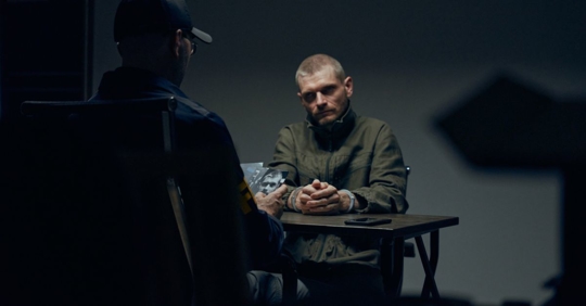 Man being interrogated by police